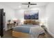 Serene bedroom with natural light, a cozy bed, desk, and minimalist decor for a relaxing atmosphere at 4094 Norton Se Pl, Smyrna, GA 30082