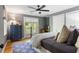 Bedroom featuring a ceiling fan, hardwood floors, and french doors leading to a balcony at 4094 Norton Se Pl, Smyrna, GA 30082