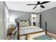 Bedroom featuring a ceiling fan, a large bed, and hardwood floors at 4094 Norton Se Pl, Smyrna, GA 30082
