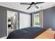 Bedroom with hardwood floors, ceiling fan, and a view to another room at 4094 Norton Se Pl, Smyrna, GA 30082