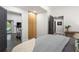Comfortable bedroom featuring a plush bed, natural light, and convenient access to other areas of the house at 4094 Norton Se Pl, Smyrna, GA 30082