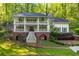 Beautiful two-story home with double porch and landscaped yard in a serene, wooded setting at 4094 Norton Se Pl, Smyrna, GA 30082