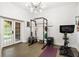 Bright home gym with natural light, showcasing modern exercise equipment and French doors at 4094 Norton Se Pl, Smyrna, GA 30082