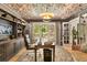 This home office has hardwood floors, a large window overlooking a backyard deck and built-in shelves at 4094 Norton Se Pl, Smyrna, GA 30082