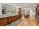 Bright kitchen with wood cabinetry, stone countertops, and breakfast area at 4094 Norton Se Pl, Smyrna, GA 30082