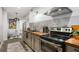 Well-equipped kitchen with stainless steel appliances and stylish finishes, adjacent to a cozy dining space at 4094 Norton Se Pl, Smyrna, GA 30082