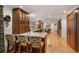 Spacious kitchen with wood cabinets, island with seating, and hardwood floors at 4094 Norton Se Pl, Smyrna, GA 30082