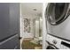 Convenient laundry area with stacked washer and dryer, located near the bathroom at 4094 Norton Se Pl, Smyrna, GA 30082