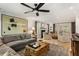 Elegant living room boasting hardwood floors, stylish seating, and a cozy fireplace at 4094 Norton Se Pl, Smyrna, GA 30082