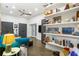 Bright living area with stylish shelving, a comfortable sofa, and access to a patio through glass doors at 4094 Norton Se Pl, Smyrna, GA 30082