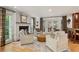 Bright living room with plush seating, a fireplace, and elegant curtains at 4094 Norton Se Pl, Smyrna, GA 30082