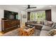 Inviting living room with hardwood floors, a comfortable sofa, and a decorative area rug at 4094 Norton Se Pl, Smyrna, GA 30082
