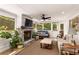 Stylish living room with a cozy fireplace, comfortable furniture, and multiple windows overlooking the outdoors at 4094 Norton Se Pl, Smyrna, GA 30082