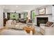Bright living room with hardwood floors, a fireplace, and stylish furnishings, creating a cozy and inviting atmosphere at 4094 Norton Se Pl, Smyrna, GA 30082