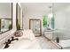 Bright bathroom with freestanding tub, glass walk-in shower, and double vanity at 4094 Norton Se Pl, Smyrna, GA 30082