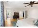 Main bedroom with hardwood floors, an ensuite bathroom, and walk-in closet at 4094 Norton Se Pl, Smyrna, GA 30082