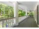 Large porch with wooded views provides a relaxing outdoor living space at 4094 Norton Se Pl, Smyrna, GA 30082