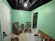 Basement area with carpeted floors, chairs, and storage areas at 602 Springharbor Dr, Woodstock, GA 30188