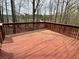 Spacious wooden deck with railings, perfect for outdoor entertaining and relaxing with a nice wooden fence at 602 Springharbor Dr, Woodstock, GA 30188