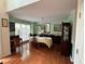 Traditional dining room features hardwood floors, chandelier, and large windows at 602 Springharbor Dr, Woodstock, GA 30188