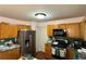 Kitchen with stainless steel refrigerator, and dark countertop at 602 Springharbor Dr, Woodstock, GA 30188