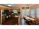 Kitchen with light wood cabinets, and an eat-in area with natural light at 602 Springharbor Dr, Woodstock, GA 30188