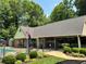 Charming poolside building offering shaded seating and picnic areas for community enjoyment at 602 Springharbor Dr, Woodstock, GA 30188