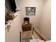 Stairway leading to upper level, featuring wooden railings and neutral carpeting, with décor at 602 Springharbor Dr, Woodstock, GA 30188