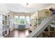 Spacious ' bedroom with hardwood floors, built-in bookshelves, and a bunk bed with a slide at 1011 W Paces Ferry Nw Rd, Atlanta, GA 30327