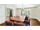 Elegant dining room with a large table, modern chandelier, and ample natural light at 1011 W Paces Ferry Nw Rd, Atlanta, GA 30327