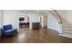 Inviting foyer with hardwood floors, curved staircase, and a view of the dining area at 1011 W Paces Ferry Nw Rd, Atlanta, GA 30327
