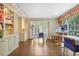 Well-lit home office with custom shelving, hardwood floors, and multiple work stations at 1011 W Paces Ferry Nw Rd, Atlanta, GA 30327