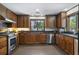 Spacious kitchen featuring stainless steel appliances, wood cabinets, and lots of natural light at 1011 W Paces Ferry Nw Rd, Atlanta, GA 30327