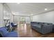 Spacious living room with fireplace, hardwood floors, and a comfortable sectional sofa at 1011 W Paces Ferry Nw Rd, Atlanta, GA 30327