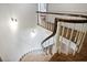 Carpeted staircase with wood railing leading upstairs in a naturally lit space at 1011 W Paces Ferry Nw Rd, Atlanta, GA 30327