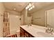 Bright bathroom with a double sink vanity, large mirror, tub with shower, and neutral décor at 4280 Azurite St, Cumming, GA 30040