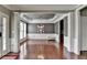 Formal dining room featuring hardwood floors, wainscoting, and a decorative light fixture at 4280 Azurite St, Cumming, GA 30040