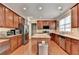 Well-equipped kitchen with granite countertops, stainless steel appliances, and hardwood floors at 4280 Azurite St, Cumming, GA 30040