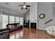 Spacious living room with a fireplace, vaulted ceilings, and hardwood floors at 4280 Azurite St, Cumming, GA 30040