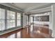 Elegant living room with hardwood floors, decorative columns, and ample natural light at 4280 Azurite St, Cumming, GA 30040