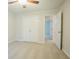 Bright bedroom featuring neutral walls, ceiling fan and closet with bi-fold doors at 429 Gold Xing, Canton, GA 30114
