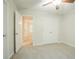 Neutral bedroom with a ceiling fan, carpeted floor and ensuite access at 429 Gold Xing, Canton, GA 30114
