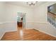 Bright dining room with hardwood floors, elegant chandelier, and direct access to the kitchen at 429 Gold Xing, Canton, GA 30114