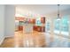 Modern kitchen with stainless steel appliances, an island, and access to the outdoor deck at 429 Gold Xing, Canton, GA 30114