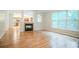 Bright open living room with hardwood floors, fireplace, and large windows with backyard views at 429 Gold Xing, Canton, GA 30114