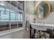 Charming bathroom with pedestal sink, classic fixtures and a large window at 745 Amberton Close, Suwanee, GA 30024
