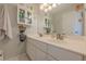 Clean bathroom offers a double vanity, bright lighting, and sleek cabinetry at 745 Amberton Close, Suwanee, GA 30024