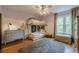Cozy bedroom featuring a unique bunk bed design with a ceiling fan and wood floors at 745 Amberton Close, Suwanee, GA 30024