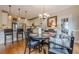 Open dining area has kitchen views with hardwood floors and traditional style decor at 745 Amberton Close, Suwanee, GA 30024