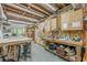 Spacious workshop with work benches, storage, natural light and a concrete floor at 745 Amberton Close, Suwanee, GA 30024